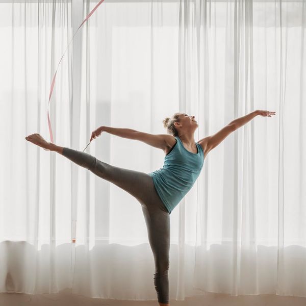 Person in a dynamic yoga flow pose, feeling energetic.